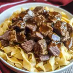 tender beef tips recipe, beef tips in gravy, easy beef tips and noodles, hearty beef noodles, beef and egg noodles recipe