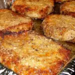 baked pork chops with Parmesan, crispy Parmesan pork chops, easy baked pork chops, pork chops with cheese crust, Parmesan crusted pork chops