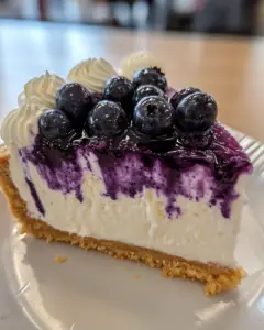 blueberry cheesecake recipe, homemade blueberry cheesecake, easy blueberry dessert, creamy fruit cheesecake, baked blueberry cheesecake