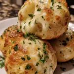 cheesy biscuit bombs, mozzarella cheese bombs, stuffed biscuit snacks, gooey cheese appetizers, biscuit and mozzarella bites, quick cheese snacks