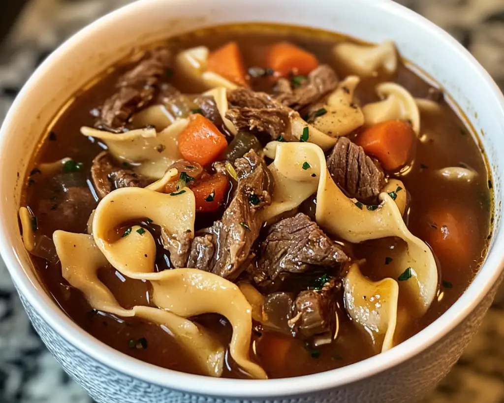 Crockpot beef noodle soup, slow cooker beef soup, beef and noodle stew, easy beef soup recipe, slow-cooked beef noodle dish