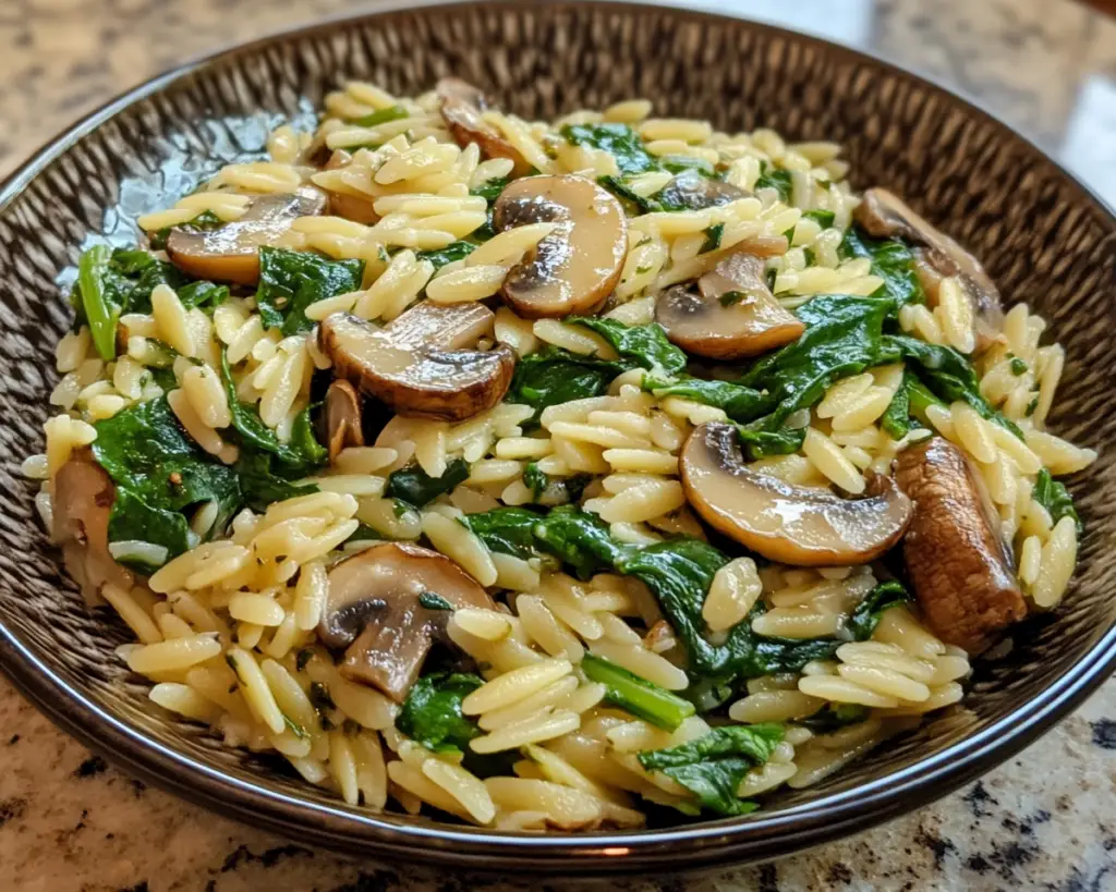 Creamy orzo recipe, mushroom and spinach pasta, vegetarian orzo dish, easy one-pot orzo, orzo with mushrooms and greens