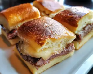 mini Monte Cristo sandwiches, sweet and savory sliders, Hawaiian roll Monte Cristo recipe, baked Monte Cristo sliders, Monte Cristo party snacks