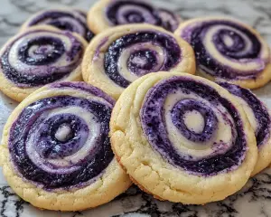 cheesecake cookies, blueberry swirl cookies, cream cheese cookies, berry-filled cookies, swirl cookies recipe, fruity cheesecake cookies, dessert cookies