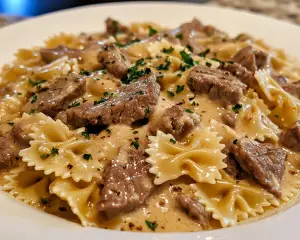 beef Alfredo pasta, creamy bowtie pasta, Alfredo sauce with beef, bowtie pasta recipes, hearty beef pasta, easy Alfredo pasta recipes