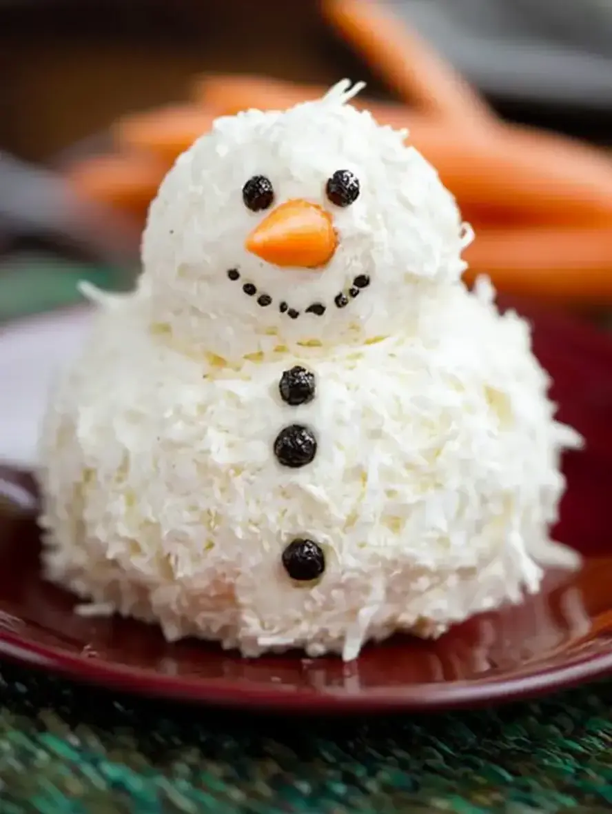 Fun Party Appetizer - Festive Snowman Cheeseball on a platter with crackers